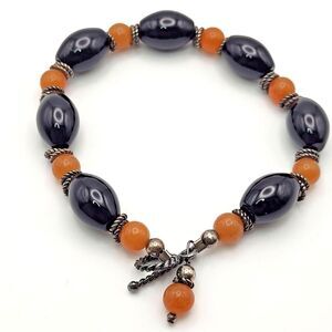 Orange and Black Glass Bracelet Silvertone Clasp and Spacers 7.5"